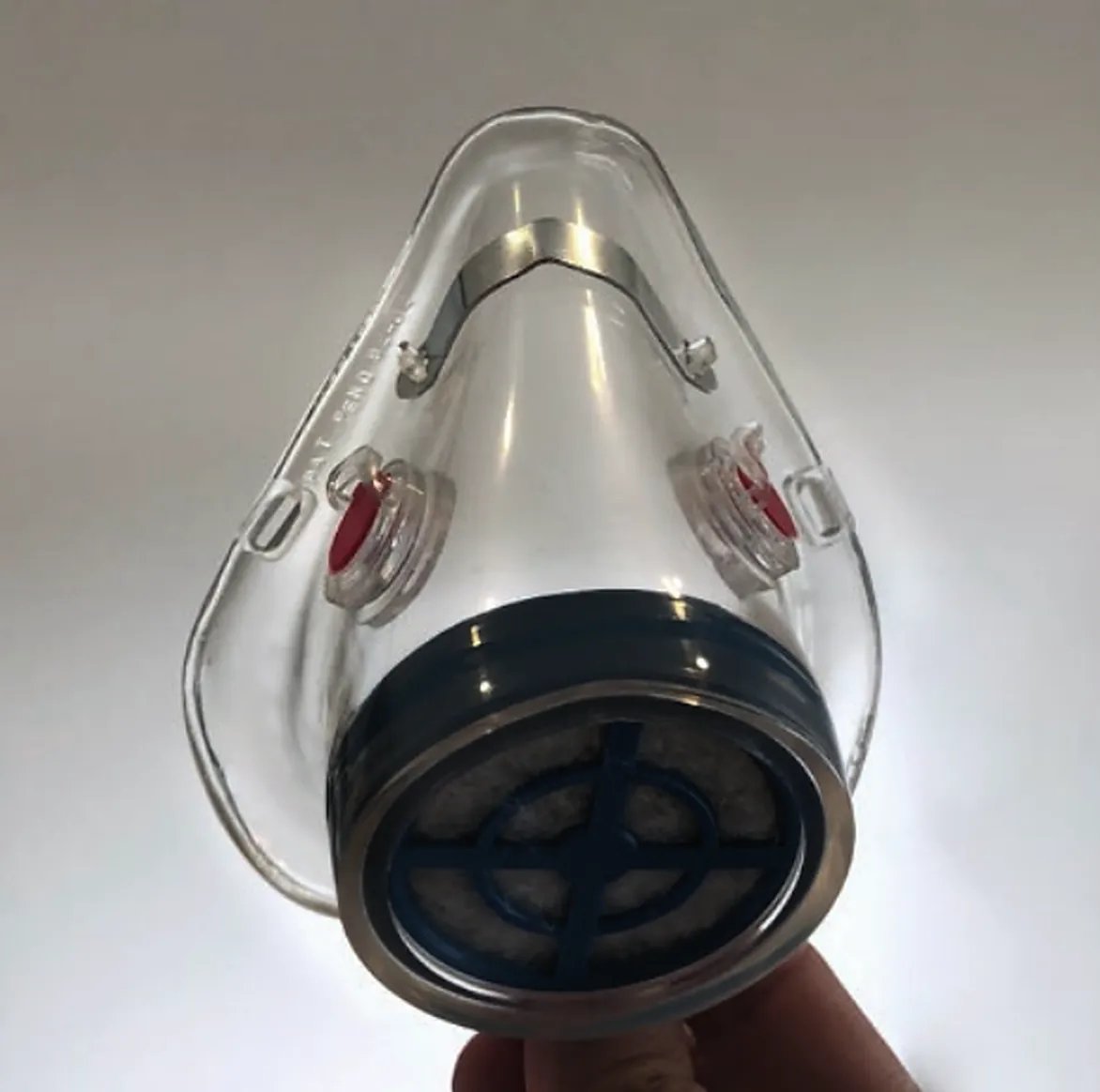 KleenAir Mask respirator from the front, with red valves and a blue cartridge